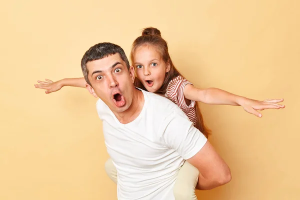 Shocked Family Having Fun Together Little Girl Piggybacking Father Isolated — Stock Photo, Image