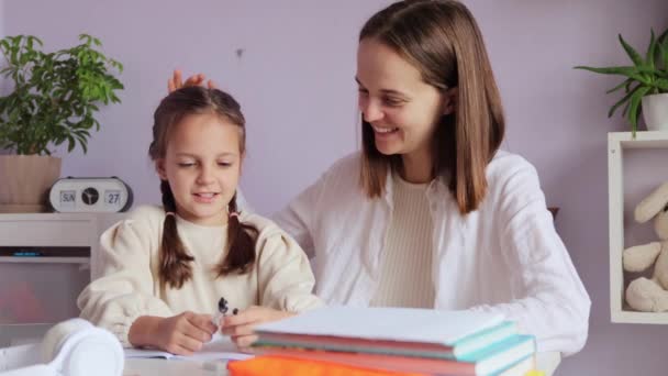 Enthusiastic Young Girl Pigtails Happily Engaged Her Schoolwork Her Mother — Stock Video