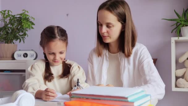Eager Small Girl Pigtails Joyfully Engrossed Her Schoolwork Her Mother — Stock Video