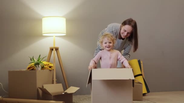 Cheerful Smiling Happy Caucasian Mother Baby Daughter Relocation New Apartment — Stock Video