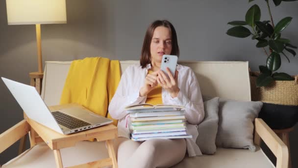 Brown Haired Woman Sitting Home Living Room Surrounded Educational Material — Stock Video