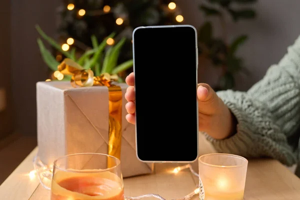 Female Hands Holding Smartphone Blank Screen Decorated Christmas Tree Present — Stock Photo, Image