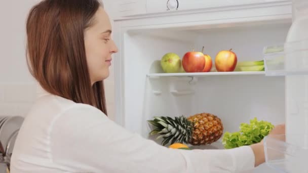 Attractive Adult Female Opening Fridge Stocked Full Fresh Produce Supporting — Stock Video