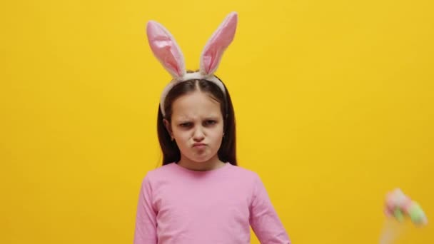 Angry Offended Little Girl Wearing Pink Rabbit Ears Headband Holding — Stock Video