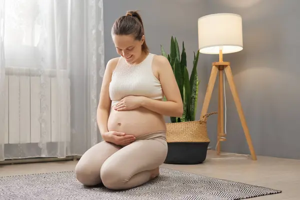 Adorable Pleased Pregnant Woman Wearing Beige Clothing Sitting Floor Living — Stock Photo, Image