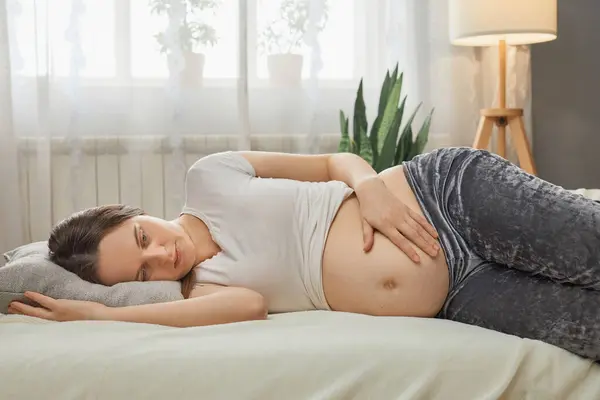 Calm Caucasian Pregnant Woman Lying Bed Touching Her Bare Tummy — Stock Photo, Image