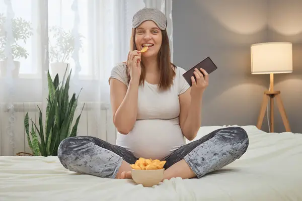 Pleased Delighted Satisfied Pregnant Woman Wearing Pajama Blindfold Sitting Bed — Stock Photo, Image