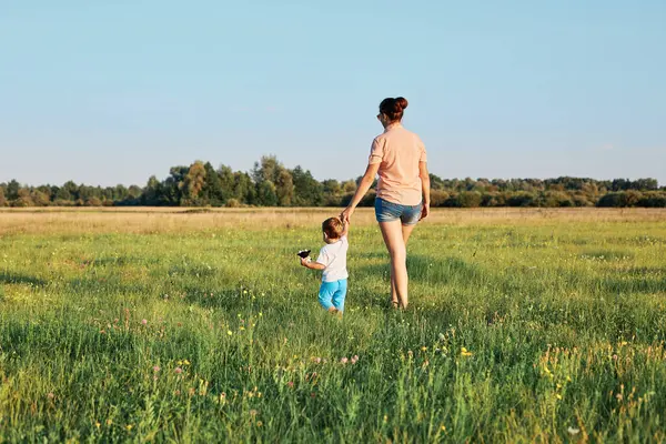 Back View Young Mother Her Infant Daughter Walking Grass Summer Royalty Free Stock Images