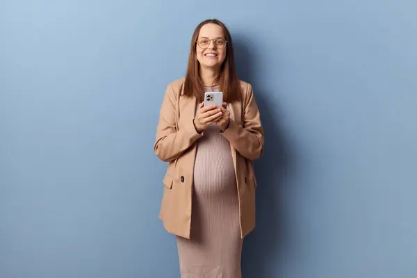 Satisfied Delighted Positive Young Adult Pregnant Woman Wearing Dress Jacket Stock Image