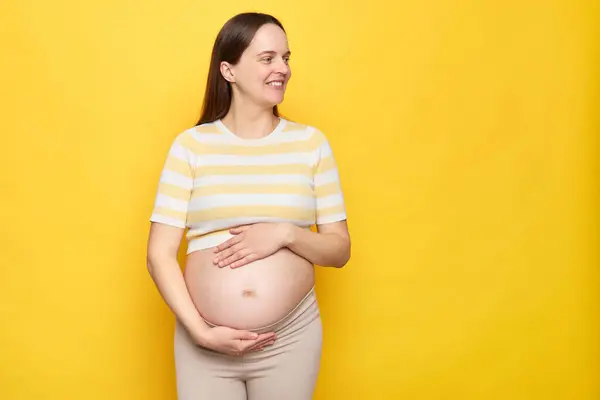 Caucasian Smiling Beautiful Young Pregnant Woman Wearing Striped Top Holding Imagen De Stock