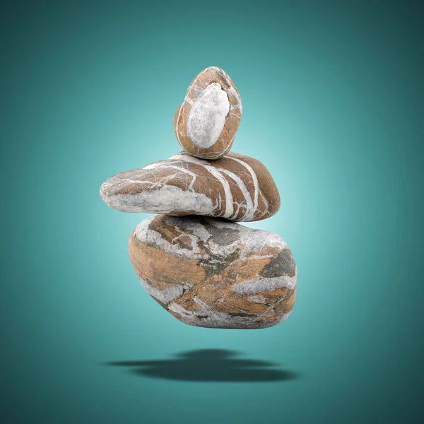 色のグラデーションの背景にバランスのとれた浮遊大理石の石 — ストック写真