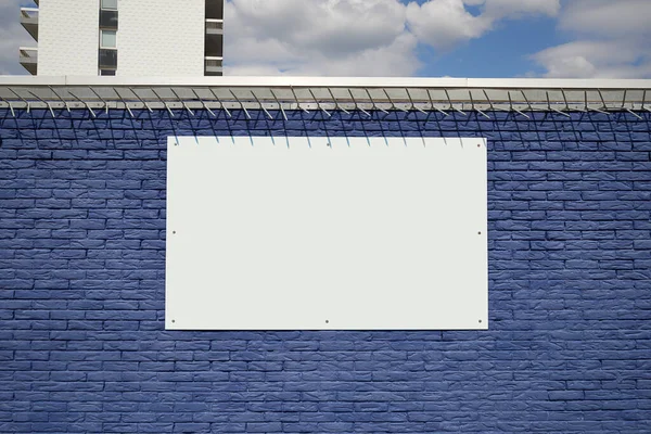 蓝砖结构墙和适合背景的空白框架 图库照片