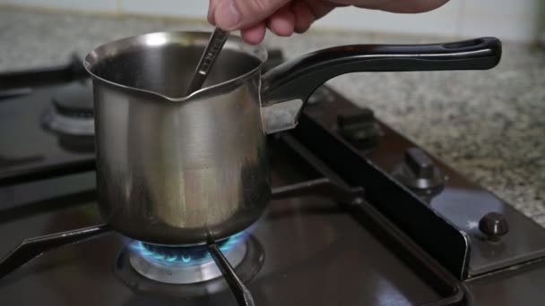 Man Hand Stirs Spoon Coffee Warmer Pan Coffee Warmer Pan — Stock Video