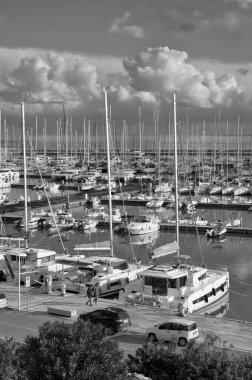 Italy, Sicily, Mediterranean sea, Marina di Ragusa (Ragusa Province); 23 January 2023, people, motor boats and luxury yachts in the port - EDITORIAL