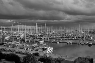 Italy, Sicily, Mediterranean sea, Marina di Ragusa; 23 January 2023, motor boats and luxury yachts in the port at sunset - EDITORIAL