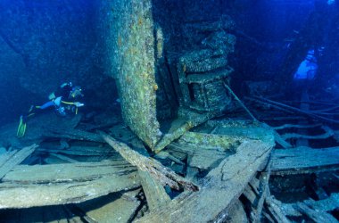 EGYPT, Red Sea, the wreck of a sunken ship and a scuba diver