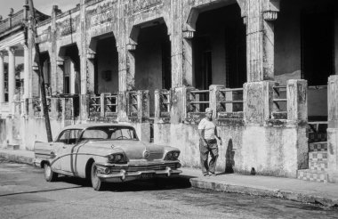 CUBA, Pinar Del Rio; 22 January 1995; cuban man with a cigar and an old american car in a street of the town - EDITORIAL