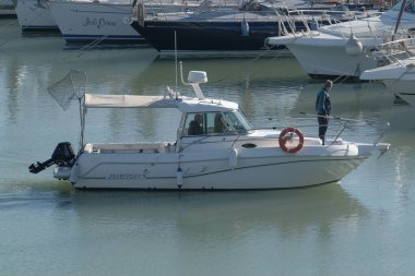Italy, Sicily, Mediterranean Sea, Marina di Ragusa (Ragusa Province); 18 February 2023, sport fishermen on a motor boat in the port - EDITORIAL