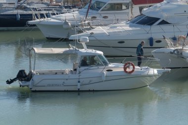 Italy, Sicily, Mediterranean Sea, Marina di Ragusa (Ragusa Province); 18 February 2023, sport fishermen on a motor boat in the port - EDITORIAL