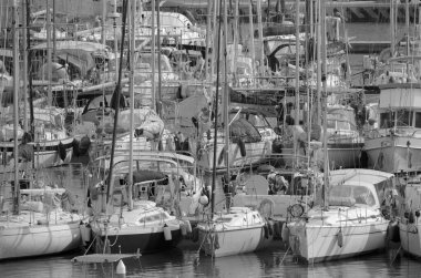 Italy, Sicily, Mediterranean Sea, Marina di Ragusa (Ragusa Province); 28 February 2023, woman on a sailing boat in the port - EDITORIAL
