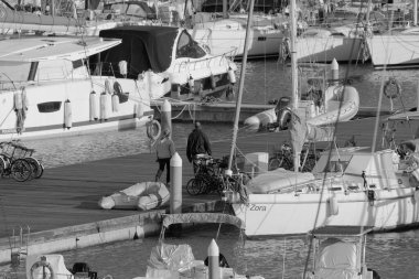 Italy, Sicily, Mediterranean sea, Marina di Ragusa (Ragusa Province); 5 March 2023, people and luxury yachts in the port - EDITORIAL