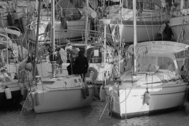 Italy, Sicily, Mediterranean sea, Marina di Ragusa (Ragusa Province); 5 March 2023, people and luxury yachts in the port - EDITORIAL