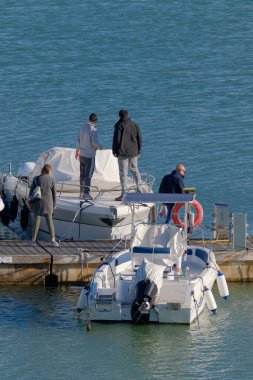 Italy, Sicily, Mediterranean sea, Marina di Ragusa (Ragusa Province); people and luxury yachts in the port 