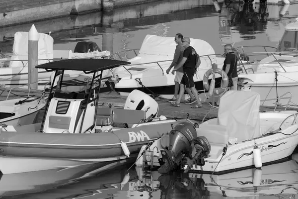 stock image Italy, Sicily, Mediterranean sea, Marina di Ragusa (Ragusa Province); 29 June 2023, people, motor boats and luxury yachts in the port - EDITORIAL