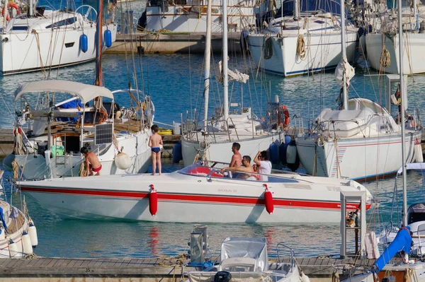 stock image Italy, Sicily, Mediterranean Sea, Marina di Ragusa (Ragusa Province); 3 July 2023, people on a luxury yacht in the port - EDITORIAL