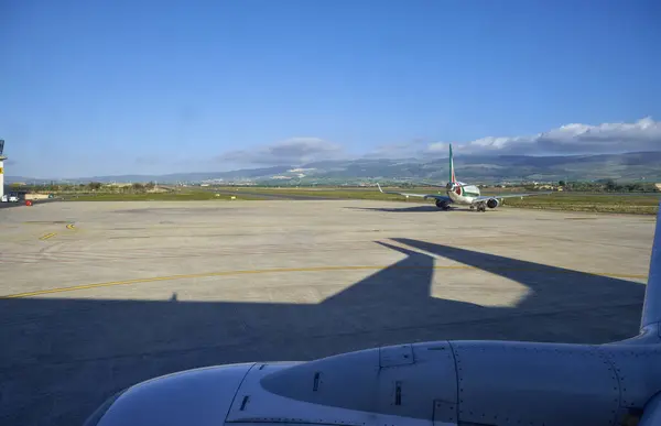 stock image Italy, Sicily, Comiso International Airport; airplane on the runway 