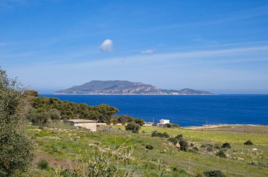 Italy, sicily, mediterranean sea, Egadi archipelago, Favignana island (Trapani Province); view of the rocky coast and Marettimo island in the backgound clipart