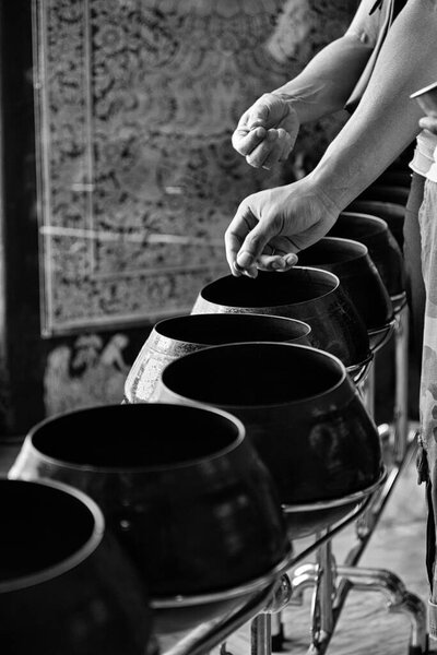 Thailand, Bangkok, Pranon Wat Pho, local money (Baht) offered by religious people