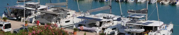 Stock image Italy, Sicily, Mediterranean sea, Marina di Ragusa (Ragusa Province); 23 July 2024, catamaran sailing boats in the port - EDITORIAL