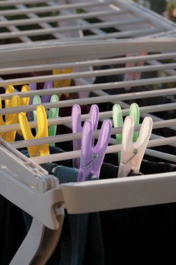 Washed clothes on a drying rack clipart