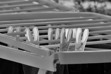 Washed clothes on a drying rack clipart