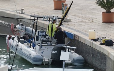 Italy, Sicily, Mediterranean Sea, Marina di Ragusa (Ragusa Province); 26 November 2024, sport fishermen on a rubber boat in the port - EDITORIAL clipart