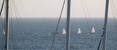 Italy, Sicily, Mediterranean sea, Marina di Ragusa (Ragusa Province); dinghies regatta and sailing boat masts clipart