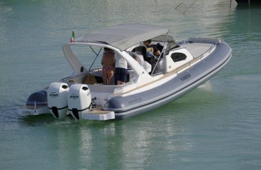 Italy, Sicily, Mediterranean Sea, Marina di Ragusa (Ragusa Province); 8 June 2025, people on a big rubber boat in the port - EDITORIAL