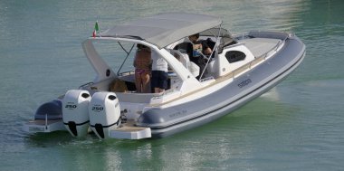 Italy, Sicily, Mediterranean Sea, Marina di Ragusa (Ragusa Province); 8 June 2025, people on a big rubber boat in the port - EDITORIAL