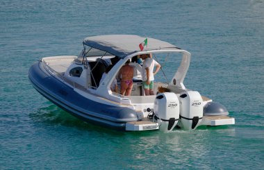 Italy, Sicily, Mediterranean Sea, Marina di Ragusa (Ragusa Province); 8 June 2025, people on a big rubber boat in the port - EDITORIAL