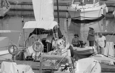 Italy, Sicily, Mediterranean sea, Marina di Ragusa (Ragusa Province); 5 March 2023, people and luxury yachts in the port - EDITORIAL