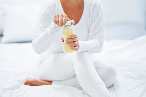 Young woman on bed with food catering. High quality photo