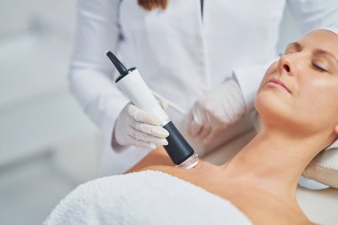 Woman in a beauty salon having face and body treatment. High quality photo