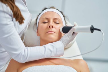 Woman in a beauty salon having face and body treatment. High quality photo
