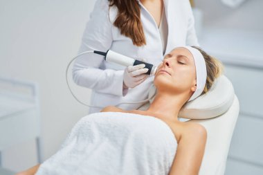 Woman in a beauty salon having face and body treatment. High quality photo