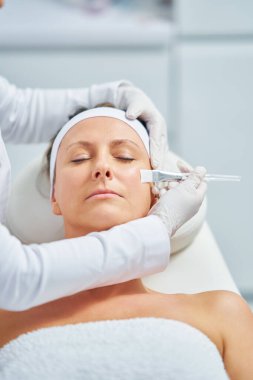 Woman in a beauty salon having face and body treatment. High quality photo