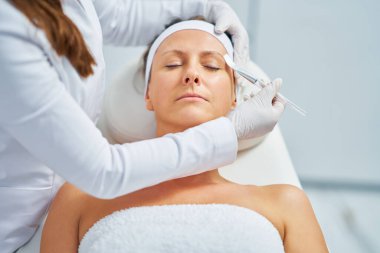 Woman in a beauty salon having face and body treatment. High quality photo
