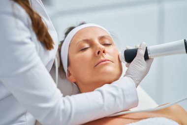 Woman in a beauty salon having face and body treatment. High quality photo