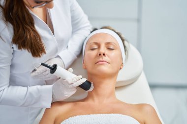 Woman in a beauty salon having face and body treatment. High quality photo