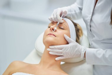 A scene of medical cosmetology treatments botulinum injection. High quality photo